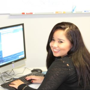 Yihra Perlata in front of computer
